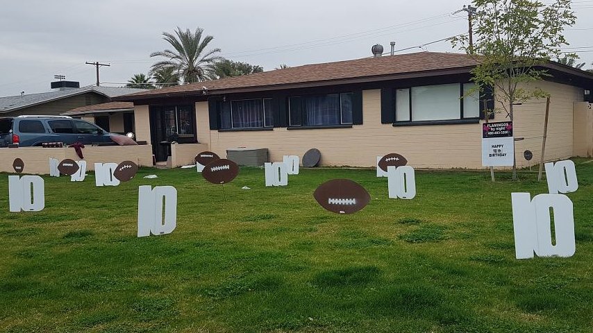 Happy 10th Birthday with footballs in yard in Snowflake AZ