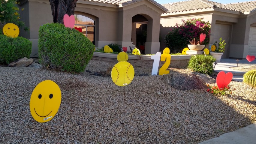 Happy birthday yard card greeting with softballs, hearts, smileys and number 12s in Scottsdale Arizona