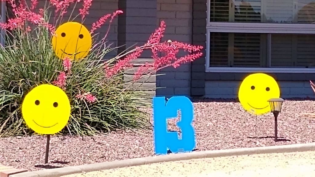 13th birthday yard sign surprise of big number 13s and amiley faces in Phoenix AZ yard