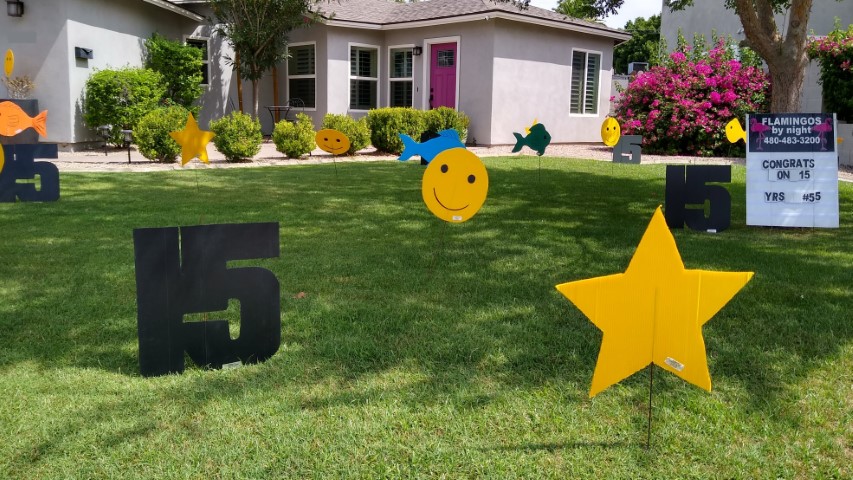 Birthday yard sign greeteing with number 15s, fish and smileys near Ahwatukee Arizonas