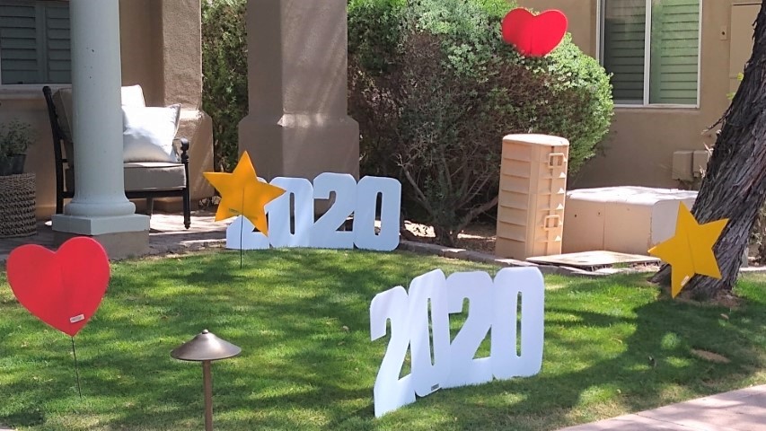 yard display for graduation of stars, hearts and 2020s near Moon Valley