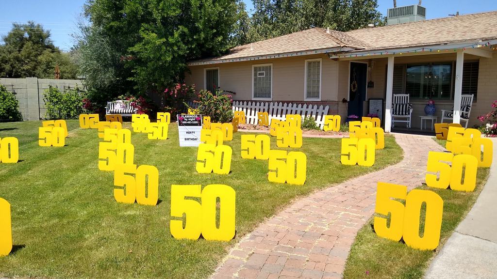 Occasion: 50s birthday surprise. 30 big number 50s in lawn greeting near Glendale