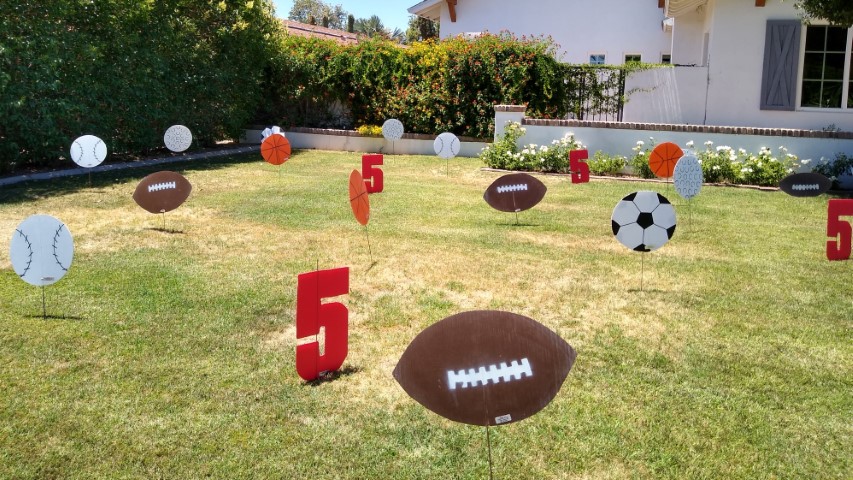 5th birthday yard sign greeting with number 5s and sports balls in Moon Valley AZ yard