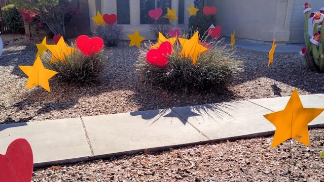 Big red hearts & yellow starsin the yard for a star Mother on her day