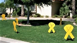 Yellow ribbons for returning military yard greeting display. Litchfield Park Arizona