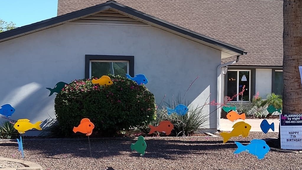 Huge school of fish yard sign greeting display. near Sun CIty Arizona