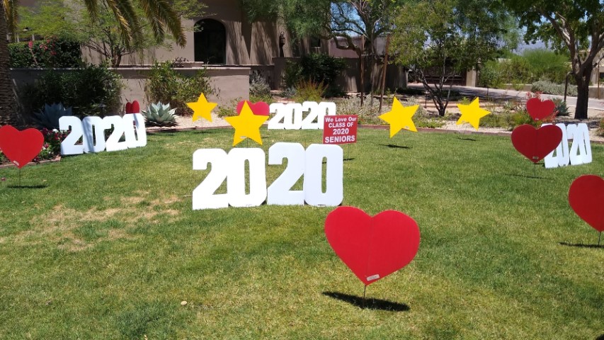 Graduation lawn announcement near Paradise Valley AZ of grad caps, numbers, stars and hearts in yard decorations
