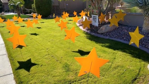 30 big yellow stars yard greeting display. Near Encanto Arizona