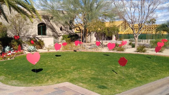 big red hearts and kisses decorations in yard