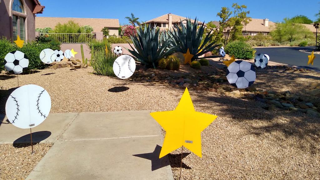 Stars, baseballs and soccer balls Birthday yard sign decorations in yard for a sports fan in Chandler AZ