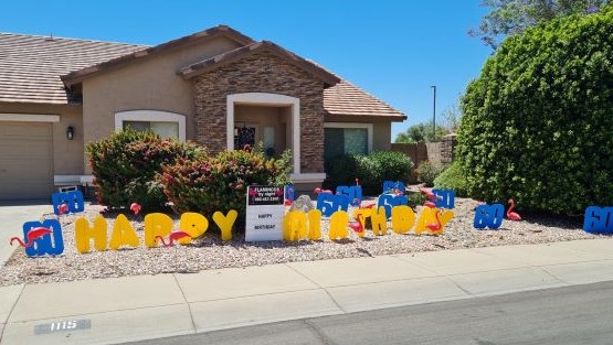 big Happy Birthday letters yard greeting with number 60s and flamingos Chandler Arizona