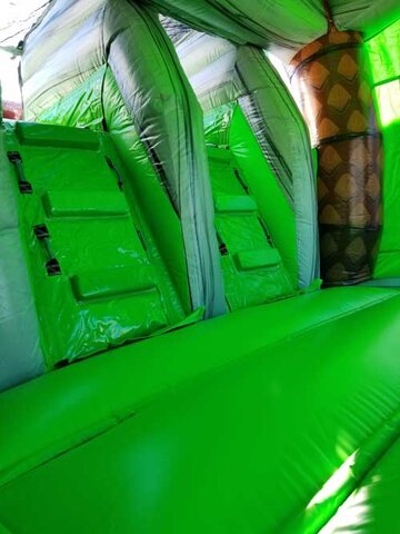 Cave Bounce House with double slide climbing wall view